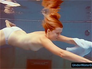 red-haired in a white dress and sexy bathing suit
